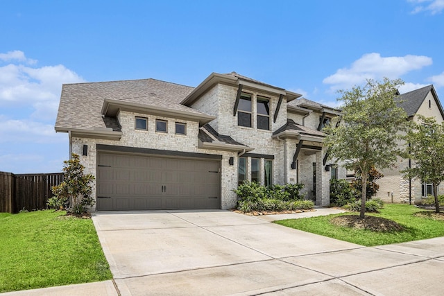 3119 Honeysuckle Way, Katy, TX 77493 - view of front of house featuring driveway, a garage, stone siding, roof with shingles, and brick siding