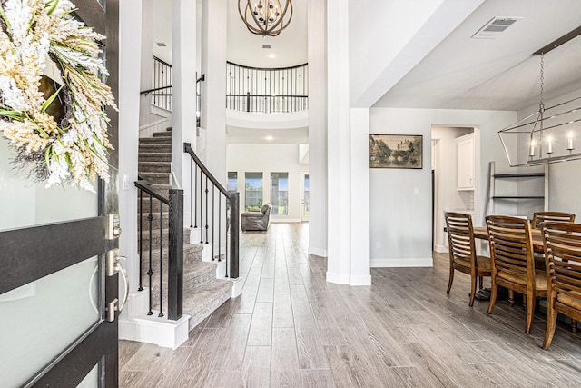 3119 Honeysuckle Way, Katy, TX 77493 - foyer with a chandelier, stairway, wood finished floors, and a towering ceiling