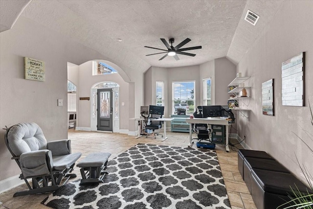 20012 Fm 523, Angleton, TX 77515 - living room with a textured ceiling, a ceiling fan, arched walkways, and a desk