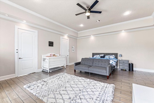 20012 Fm 523, Angleton, TX 77515 - bedroom with wood finished floors, crown molding, recessed lighting, a textured ceiling, and a ceiling fan