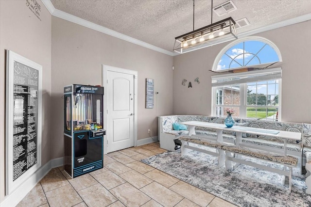 20012 Fm 523, Angleton, TX 77515 - dining space with crown molding, a textured ceiling, and light tile patterned flooring