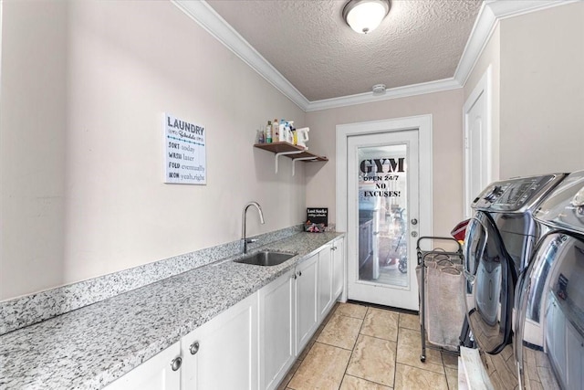 20012 Fm 523, Angleton, TX 77515 - laundry room featuring washer and clothes dryer, cabinet space, a textured ceiling, crown molding, and bar with sink