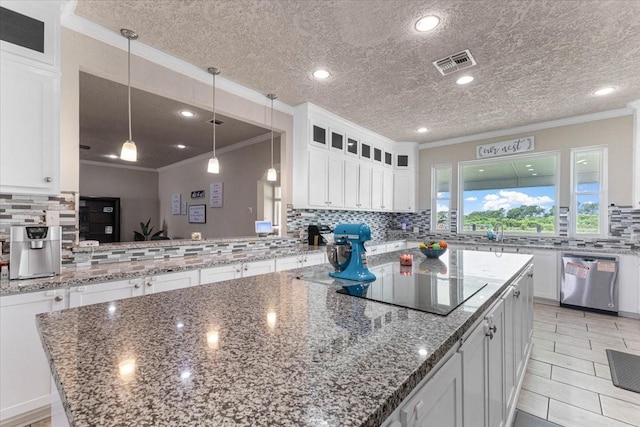 20012 Fm 523, Angleton, TX 77515 - kitchen with stainless steel dishwasher, tasteful backsplash, black electric stovetop, a kitchen island, and ornamental molding