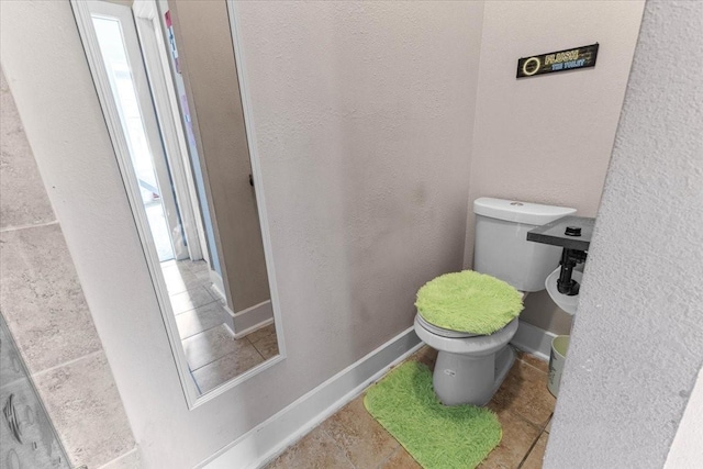 20012 Fm 523, Angleton, TX 77515 - bathroom with toilet and tile patterned floors