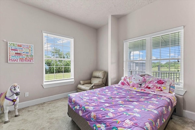 20012 Fm 523, Angleton, TX 77515 - bedroom featuring carpet flooring, multiple windows, and a textured ceiling