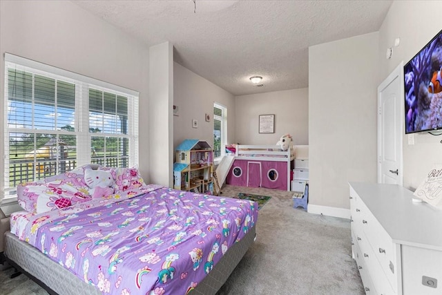 20012 Fm 523, Angleton, TX 77515 - bedroom with light carpet and a textured ceiling