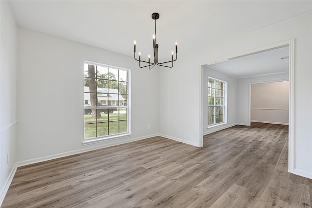 910 Woodchurch Ln, Houston, TX 77073 - spare room with a chandelier and wood finished floors
