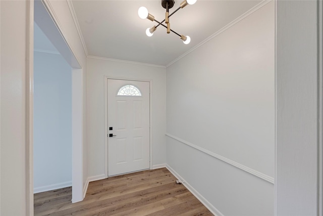 910 Woodchurch Ln, Houston, TX 77073 - entrance foyer with a chandelier, light wood-style floors, and ornamental molding