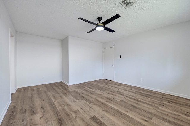 910 Woodchurch Ln, Houston, TX 77073 - unfurnished room with wood finished floors, a ceiling fan, and a textured ceiling