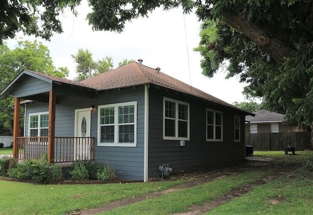 1306 S Austin St, Brenham, TX 77833 - view of property exterior featuring roof with shingles