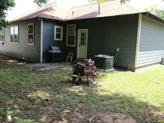 1306 S Austin St, Brenham, TX 77833 - back of house featuring a yard and a shingled roof