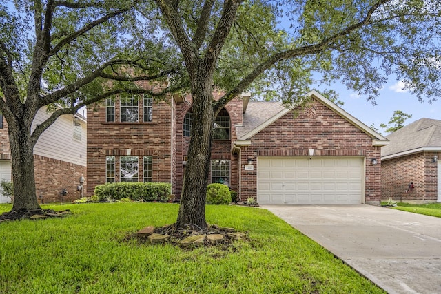 7214 Emerald Run Ln, Spring, TX 77379 - traditional home with brick siding, concrete driveway, a front yard, and a garage