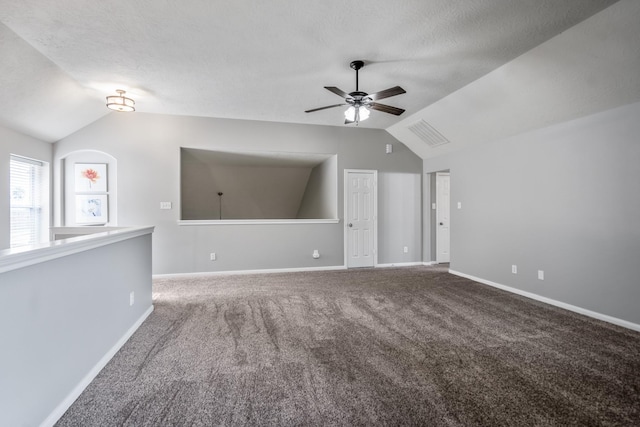 7214 Emerald Run Ln, Spring, TX 77379 - additional living space with vaulted ceiling, a ceiling fan, carpet flooring, and a textured ceiling