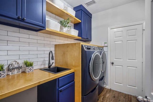 7214 Emerald Run Ln, Spring, TX 77379 - laundry room featuring cabinet space, separate washer and dryer, and dark wood-style floors