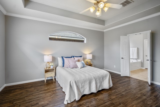 7214 Emerald Run Ln, Spring, TX 77379 - bedroom featuring a raised ceiling, wood finished floors, crown molding, and ensuite bathroom