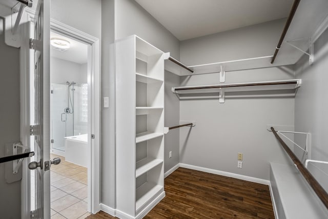 7214 Emerald Run Ln, Spring, TX 77379 - spacious closet featuring wood finished floors