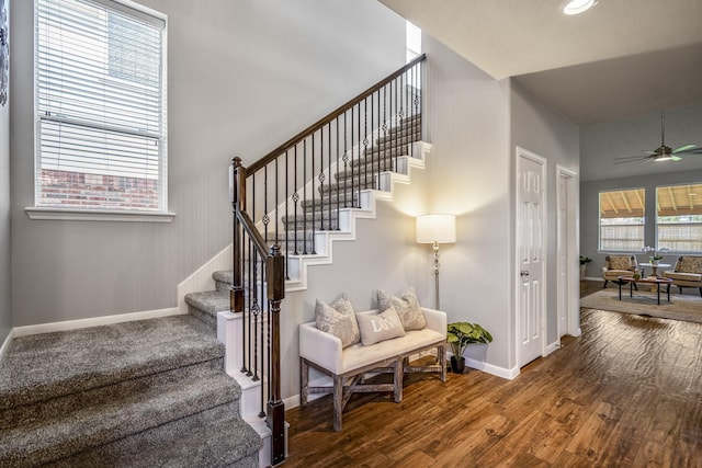 7214 Emerald Run Ln, Spring, TX 77379 - stairway with wood finished floors and a ceiling fan