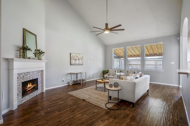 7214 Emerald Run Ln, Spring, TX 77379 - living area featuring high vaulted ceiling, ceiling fan, dark wood-style floors, and a tiled fireplace