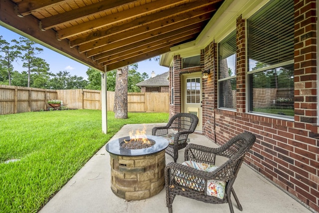 7214 Emerald Run Ln, Spring, TX 77379 - fenced backyard featuring an outdoor fire pit and a patio
