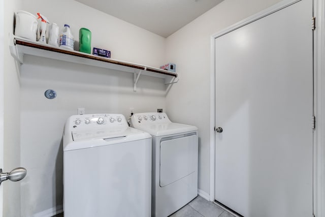 14726 Lark Sky Way, Cypress, TX 77429 - laundry area featuring washer and clothes dryer and light tile patterned flooring