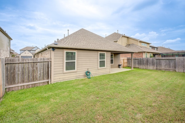 14726 Lark Sky Way, Cypress, TX 77429 - rear view of property with a shingled roof, a fenced backyard, and a patio