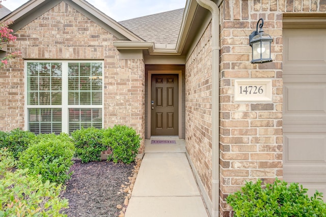 14726 Lark Sky Way, Cypress, TX 77429 - doorway to property with brick siding and roof with shingles