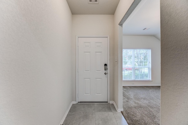 14726 Lark Sky Way, Cypress, TX 77429 - doorway to outside with a textured wall and light tile patterned floors
