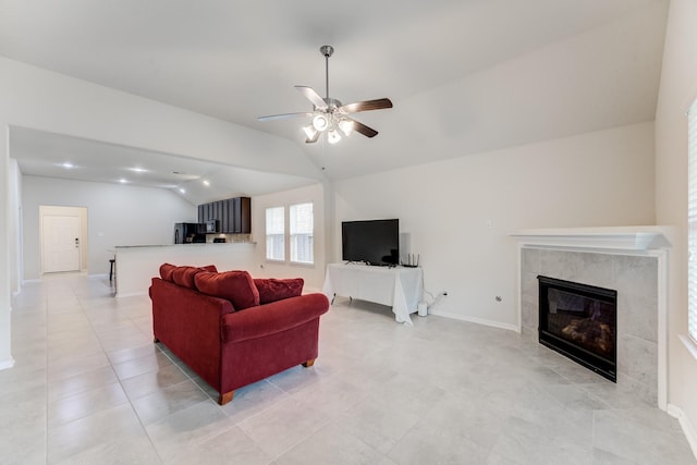 14726 Lark Sky Way, Cypress, TX 77429 - living area with lofted ceiling, a ceiling fan, a tile fireplace, and light tile patterned flooring