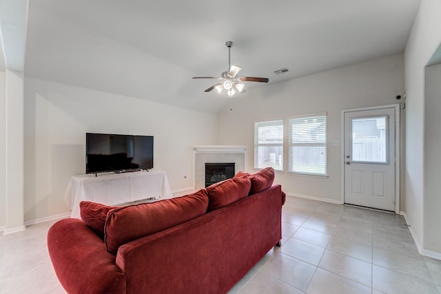 14726 Lark Sky Way, Cypress, TX 77429 - living area with a ceiling fan, a tile fireplace, vaulted ceiling, and light tile patterned floors