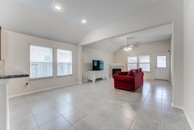 14726 Lark Sky Way, Cypress, TX 77429 - living room featuring a tiled fireplace, a ceiling fan, light tile patterned floors, lofted ceiling, and recessed lighting