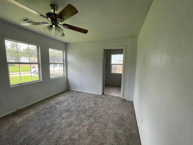 5746 Groveton St, Houston, TX 77033 - carpeted spare room featuring ceiling fan and baseboards