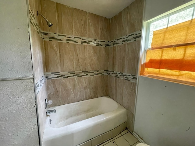 5746 Groveton St, Houston, TX 77033 - bathroom featuring tile patterned floors and bathing tub / shower combination