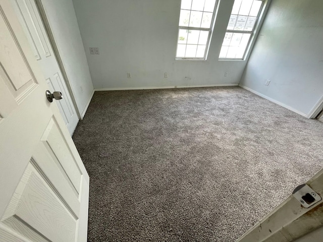 5746 Groveton St, Houston, TX 77033 - carpeted empty room with baseboards