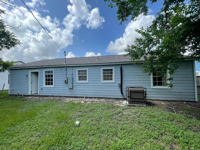 5746 Groveton St, Houston, TX 77033 - back of house with a lawn