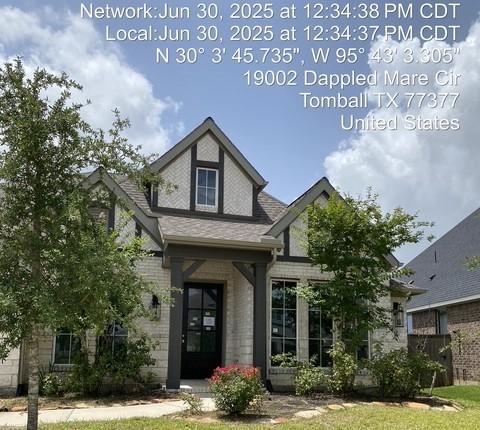 19007 Dappled Mare Cir, Tomball, TX 77377 - view of front of home with brick siding and roof with shingles