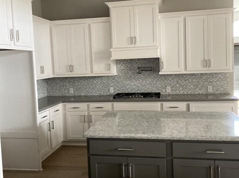 19007 Dappled Mare Cir, Tomball, TX 77377 - kitchen featuring fridge, gray cabinets, white cabinetry, and light stone counters