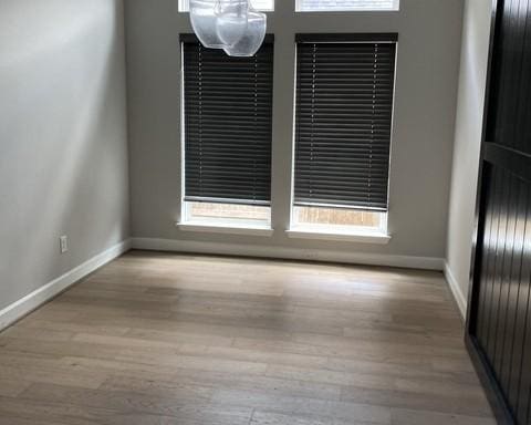 19007 Dappled Mare Cir, Tomball, TX 77377 - empty room featuring wood finished floors and healthy amount of natural light