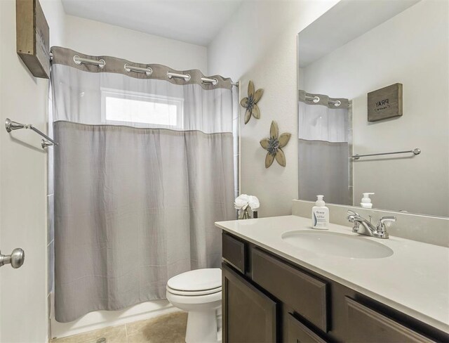 17023 Canosa Dr, Cypress, TX 77433 - full bathroom featuring vanity, tile patterned floors, and shower / tub combo with curtain