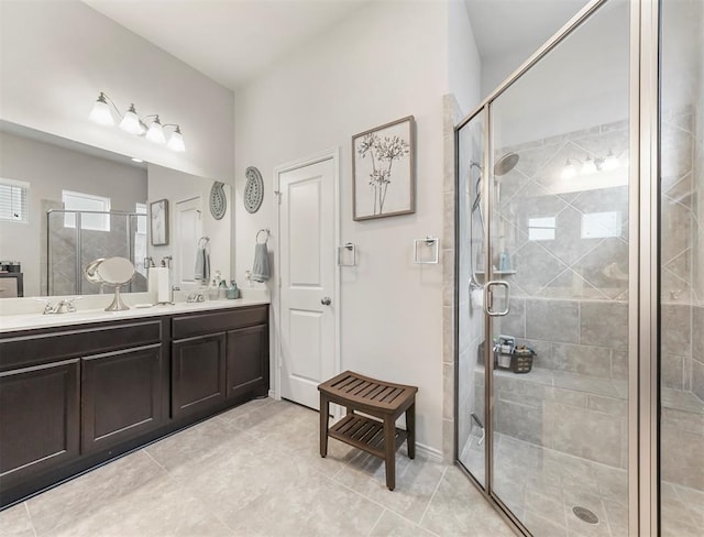 17023 Canosa Dr, Cypress, TX 77433 - full bath featuring double vanity, a stall shower, and tile patterned flooring