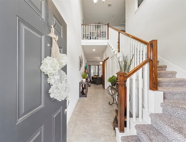17023 Canosa Dr, Cypress, TX 77433 - foyer featuring stairway, a high ceiling, and light tile patterned flooring