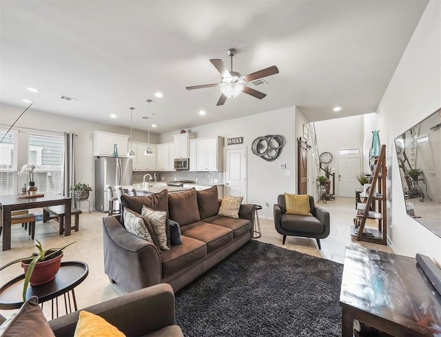 17023 Canosa Dr, Cypress, TX 77433 - living area featuring ceiling fan, recessed lighting, and light tile patterned flooring