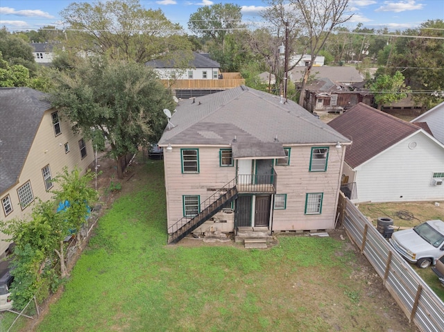 3213 Des Chaumes St, Houston, TX 77026 - back of property featuring a fenced backyard and stairway