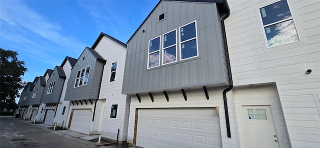 4922 Hoover St Unit A, Houston, TX 77092 - view of home's exterior featuring board and batten siding and a garage