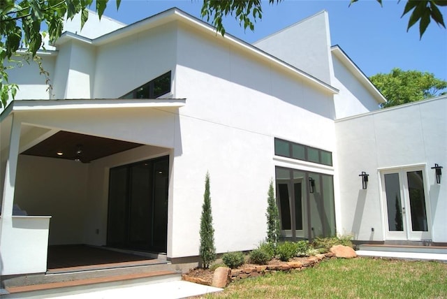2214 Hewitt Dr, Houston, TX 77018 - view of exterior entry with french doors and stucco siding