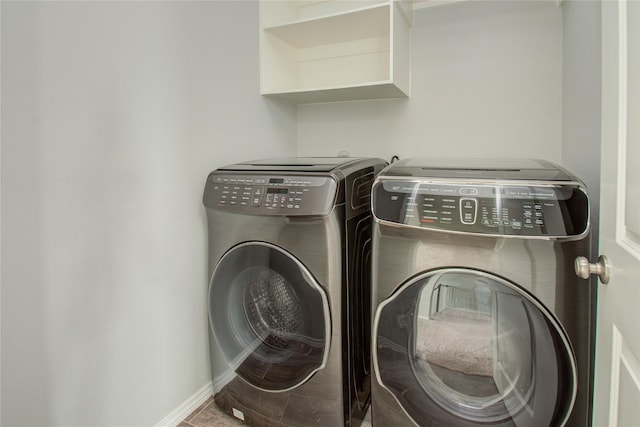 17019 Canosa Dr, Cypress, TX 77433 - laundry area with washing machine and clothes dryer and baseboards