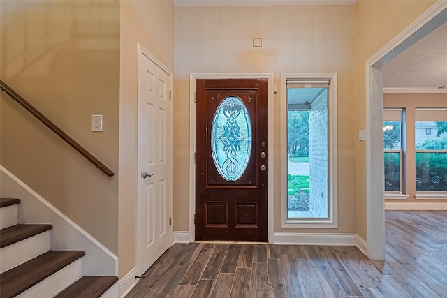 5942 Pebble Springs Dr, Houston, TX 77066 - entryway with dark wood finished floors, stairway, and crown molding