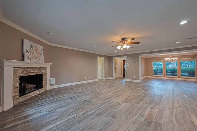 5942 Pebble Springs Dr, Houston, TX 77066 - unfurnished living room featuring wood finished floors, ceiling fan, a chandelier, a fireplace, and recessed lighting