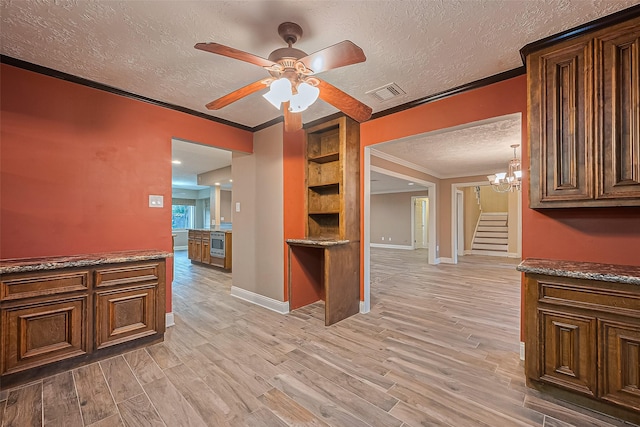 5942 Pebble Springs Dr, Houston, TX 77066 - interior space with crown molding, a textured ceiling, ceiling fan, light wood-style flooring, and a chandelier