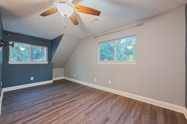 5942 Pebble Springs Dr, Houston, TX 77066 - additional living space featuring wood finished floors, plenty of natural light, a ceiling fan, a textured ceiling, and lofted ceiling
