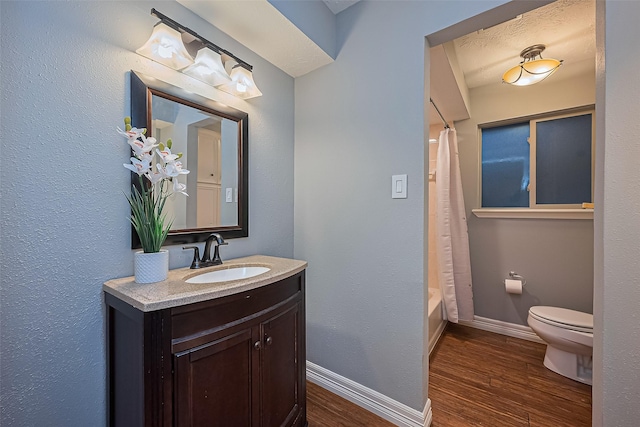 5942 Pebble Springs Dr, Houston, TX 77066 - full bath with wood finished floors, vanity, and shower / bathtub combination with curtain